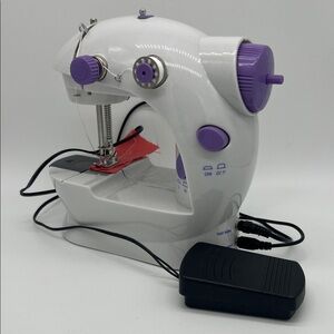 Compact White and Purple Sewing Machine
